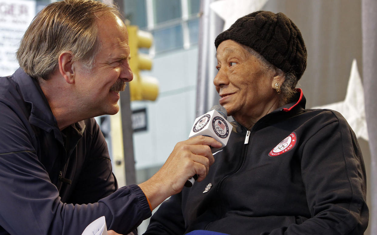 Alice Coachman, a gold medalist in the high jump at the 1948 Olympics, being interviewed by Olympic swimmer John Nabor. (Bebeto Matthews / AP)