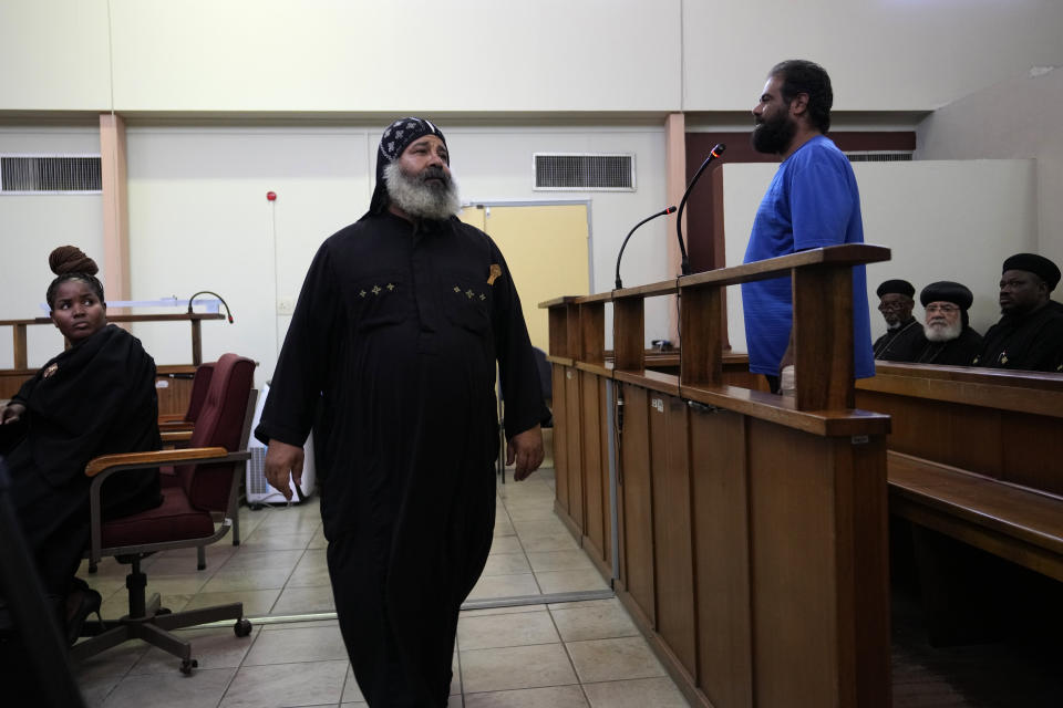 Two suspects appear at the magistrate court in Cullinan, a town east of Pretoria, South Africa, Thursday, March 14, 2024. The two suspects appeared at the court for the murder of three Egyptian monks belonging to the Coptic Orthodox Church at a monastery in South Africa. (AP Photo/Themba Hadebe)