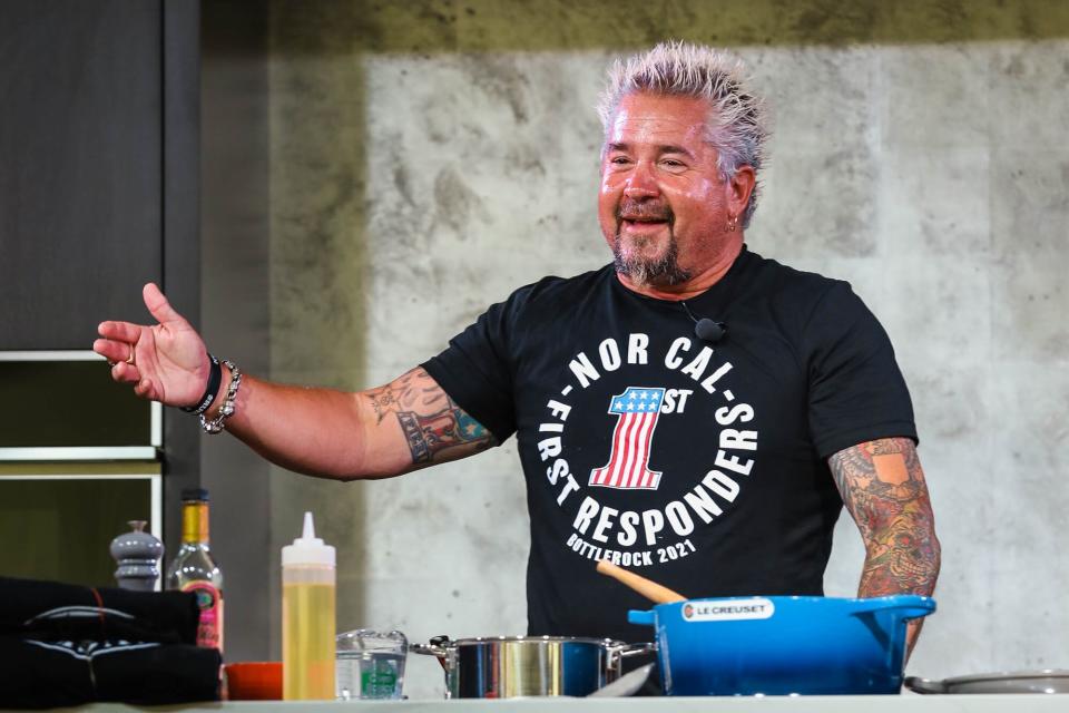 Guy Fieri cooking at the Food &amp; Wine Classic in Aspen, 2021