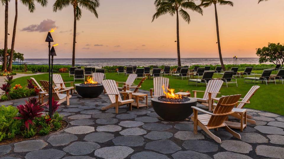 Firepits and chairs by the water at Ko'a Kea Resort, voted one of the best in Hawaii