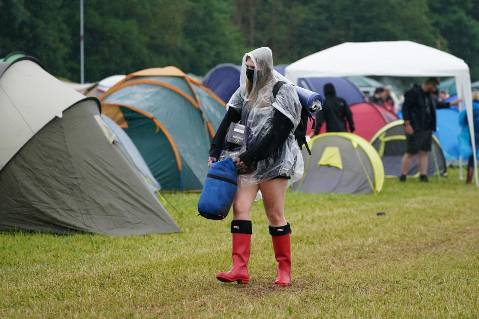 <p>A festivalgoer arrives on the first day of Download Festival at Donington Park in Leicestershire. Picture date: Friday June 18, 2021.</p>
