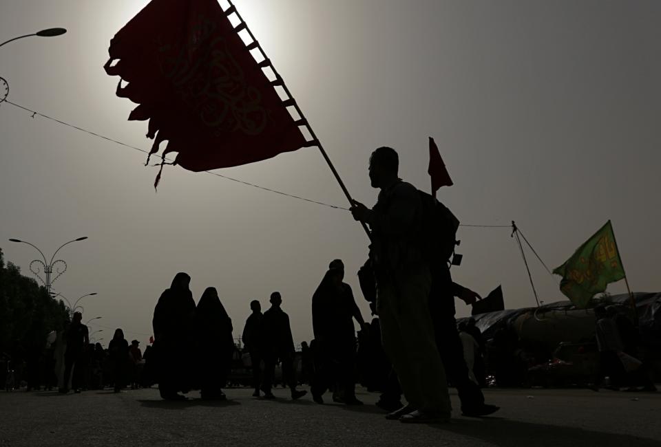 In this Sunday, Oct. 28, 2018 photo, Shiite pilgrims march to their holy shrines for Arbaeen, outside Karbala, Iraq. Millions of Shia Muslims from around the world are making the journey to the holy shrines of their saints Hussein and Abbas, in a pilgrimage that is as much about camaraderie as religion. The annual commemoration, called Arbeen, brings more pilgrims each year than the Hajj, in Saudi Arabia, yet it is hardly known outside Islam. (AP Photo/Hadi Mizban)