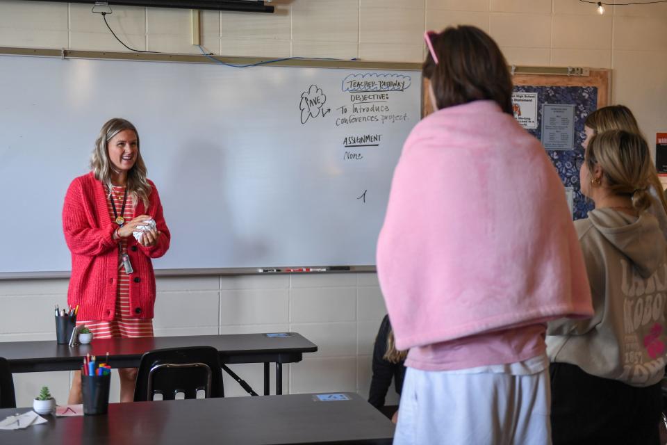 Washington High School teacher Alison Terhorst works with her students to decorate her classroom door for an annual contest on Wednesday, Oct. 4, 2023 at Washington High School in Sioux Falls, South Dakota.