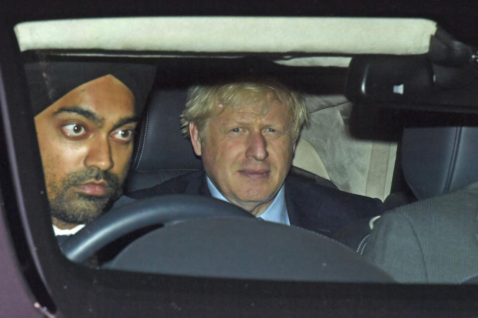 Prime Minister Boris Johnson leaves the House of Commons, London, after judges at the Supreme Court ruled that his advice to the Queen to suspend Parliament for five weeks was unlawful, Wednesday September 25, 2019. (Kirsty O' Connor/PA via AP)