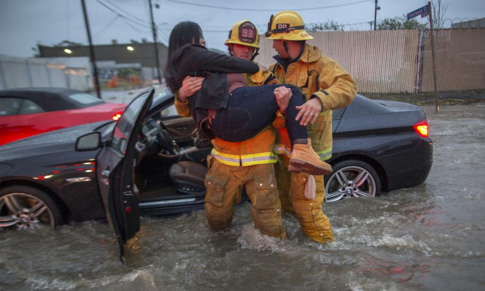  A firefighter carries a woman from her car after it was caught in street flooding as a powerful storm moves across Southern California on February 17, 2017 in Sun Valley, California. After years of severe drought, heavy winter rains have come to the state and the evacuation of hundreds of residents from Duarte, California for fear of flash flooding from areas denuded by a wildfire last year. Research has shown that California’s drought was likely worsened by climate change. And climate change, as well, is also leading to heavier, more extreme rainfalls worldwide. 