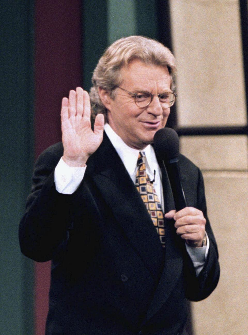 FILE - Talk-show host Jerry Springer jokes with the crowd before the taping of his show at NBC studios in Chicago, Ill., in November 1996. Springer, the former Cincinnati mayor and news anchor whose namesake TV show unleashed strippers, homewreckers and skinheads to brawl and spew obscenities on weekday afternoons, has died. He was 79. A family spokesperson died Thursday at home in suburban Chicago. (Jim Slosiarek/The Journal Times via AP, File)