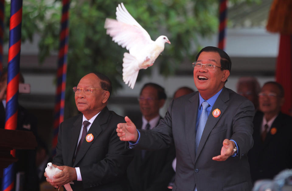 Doves fly in Phnom Penh