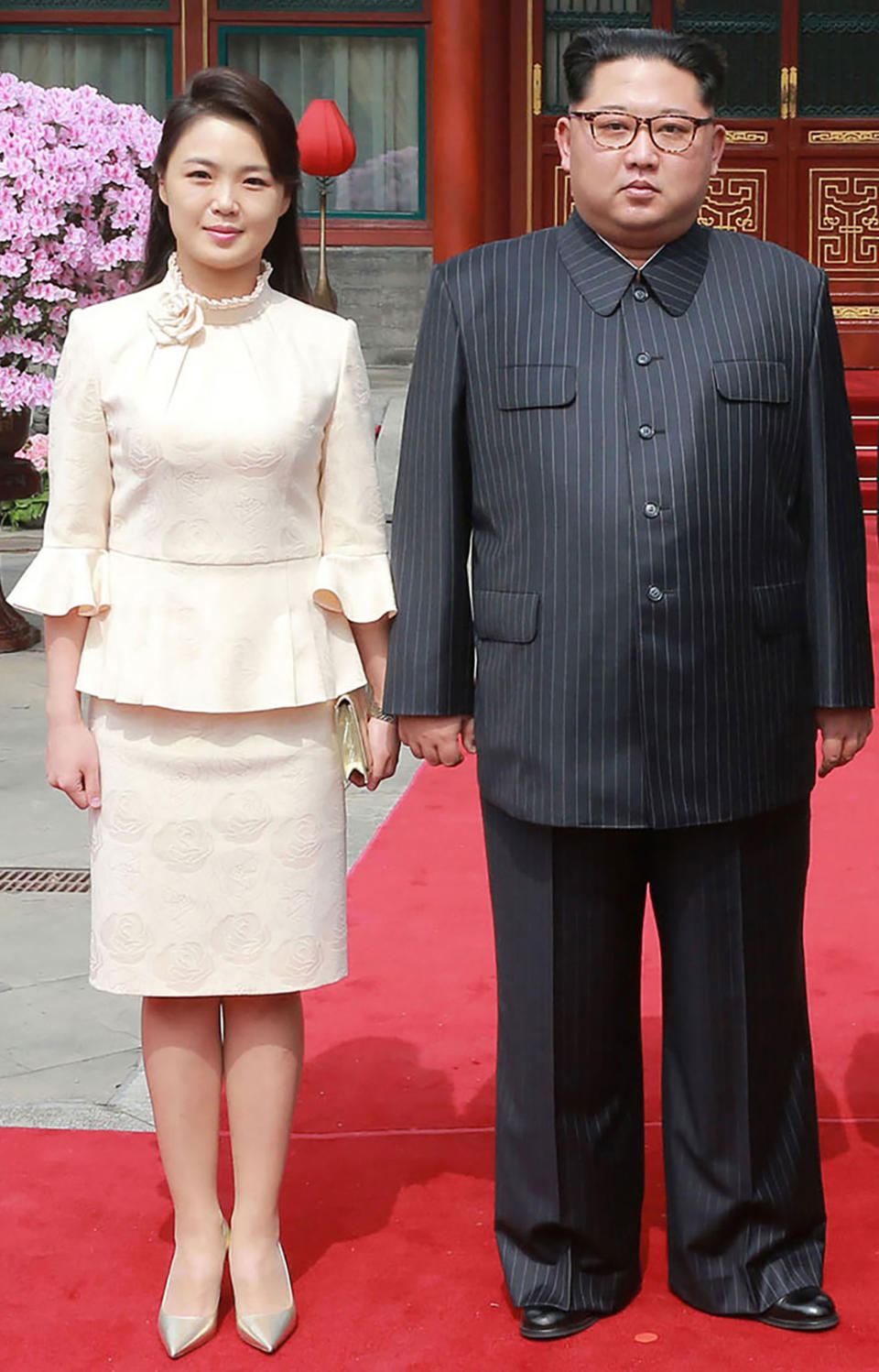 <p>This picture from North Korea’s official Korean Central News Agency (KCNA) taken on March 27, 2018 and released on March 28, 2018 shows North Korean leader Kim Jong Un and his wife Ri Sol Ju posing for a picture in Beijing. (Photo: KCNA VIA KNS AFP/Getty Images) </p>