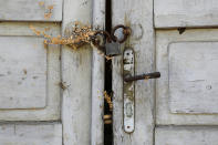 <p>The locked door of an abandoned house is seen in the village of Aldinac, near the southeastern town of Knjazevac, Serbia, Aug. 15, 2017. (Photo: Marko Djurica/Reuters) </p>