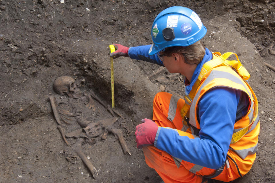 In this undated but recent photo supplied Friday March 15, 2015, by the London Crossrail Project, showing archaeologists working on the UK’s largest infrastructure project, Crossrail, as they uncover an historical burial ground in central London. Scientists were called in to investigate bones found during the digging of a new railway in central London, after uncovered 13 skeletons were found. The skeletons will be tested to see if they died from the Black Death plague which killed between 30 and 60 percent of the European population in the 14th century, and scientist hope to map the DNA signature of the plague bacteria. (AP Photo / Crossrail Project)