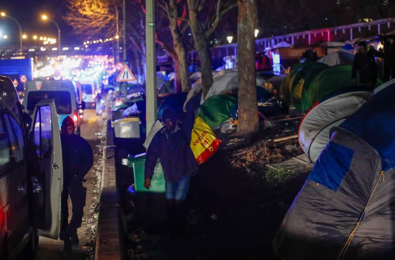 French police clear out migrants from an illegal camp in north Paris
