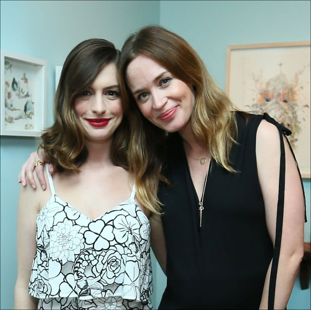  Anne Hathaway (L) and actress Emily Blunt attend Disney's Alice Through the Looking Glass event on May 12, 2016 at Roseark in Los Angeles California. 