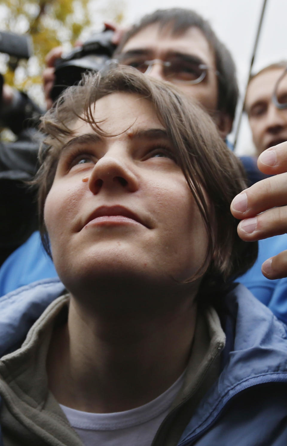 Freed feminist punk group Pussy Riot member Yekaterina Samutsevich speaks outside a court in Moscow, Wednesday Oct. 10, 2012. A Moscow appeals court on Wednesday unexpectedly freed one of the jailed Pussy Riot members, but upheld the two-year prison sentence for the two others jailed for an irreverent protest against President Vladimir Putin. The Moscow City Court ruled that Yekaterina Samutsevich’s sentence should be suspended because she was thrown out of the cathedral by guards before she could remove her guitar from its case and take part in the performance. (AP Photo/Sergey Ponomarev)