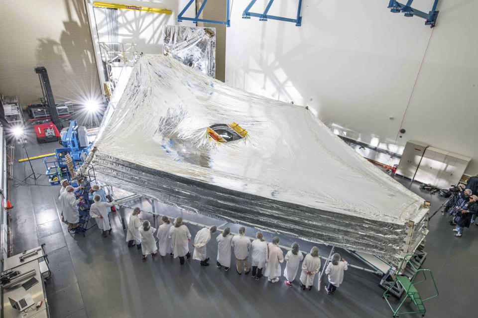 The Sunshield test unit to be used on NASA's James Webb Space Telescope is stacked and expanded at a cleanroom in the Northrop Grumman facility in Redondo Beach, California, in this NASA handout picture released July 25, 2014.  The Sunshield separates the observatory into a warm sun-facing side and a cold side where the sunshine is blocked from interfering with the sensitive infrared instruments.   REUTERS/NASA/Chris Gunn/Handout   (UNITED STATES - Tags: SCIENCE TECHNOLOGY)  ATTENTION EDITORS - THIS PICTURE WAS PROVIDED BY A THIRD PARTY. REUTERS IS UNABLE TO INDEPENDENTLY VERIFY THE AUTHENTICITY, CONTENT, LOCATION OR DATE OF THIS IMAGE. THIS PICTURE IS DISTRIBUTED EXACTLY AS RECEIVED BY REUTERS, AS A SERVICE TO CLIENTS. FOR EDITORIAL USE ONLY. NOT FOR SALE FOR MARKETING OR ADVERTISING CAMPAIGNS