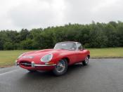 <p>You can't mention Grand Touring cars without bringing up the Jaguar E-Type. It's become an icon in the classic car world, sought after by collectors for its fantastic design and wonderful driving elements. You can own <a href="https://www.ebay.com/itm/1965-Jaguar-E-Type-4-2-liter-Series-1-Roadster/402331642504?hash=item5dacd5aa88:g:9p4AAOSwtM5fB0EM" rel="nofollow noopener" target="_blank" data-ylk="slk:this British racing green Series I model;elm:context_link;itc:0;sec:content-canvas" class="link ">this British racing green Series I model</a> today. </p>