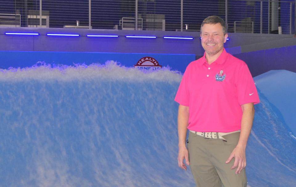 Bryan Goff, the operations general manager at Genesis Sports Complex, stands in front of the surf machine in the soon-to-open Blast Off Bay.