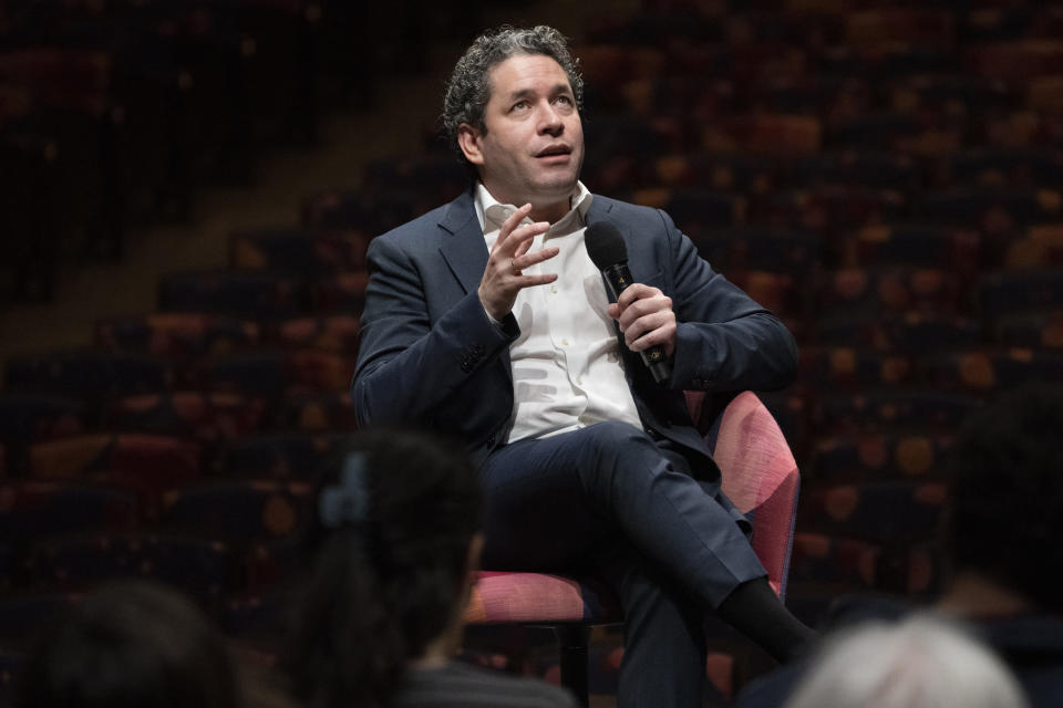 Gustavo Dudamel is introduced as the New York Philharmonic's 27th music and artistic director, Monday, Feb. 20, 2023, in the newly renovated David Geffen Hall at Lincoln Center for the Performing Arts in New York. (AP Photo/John Minchillo)