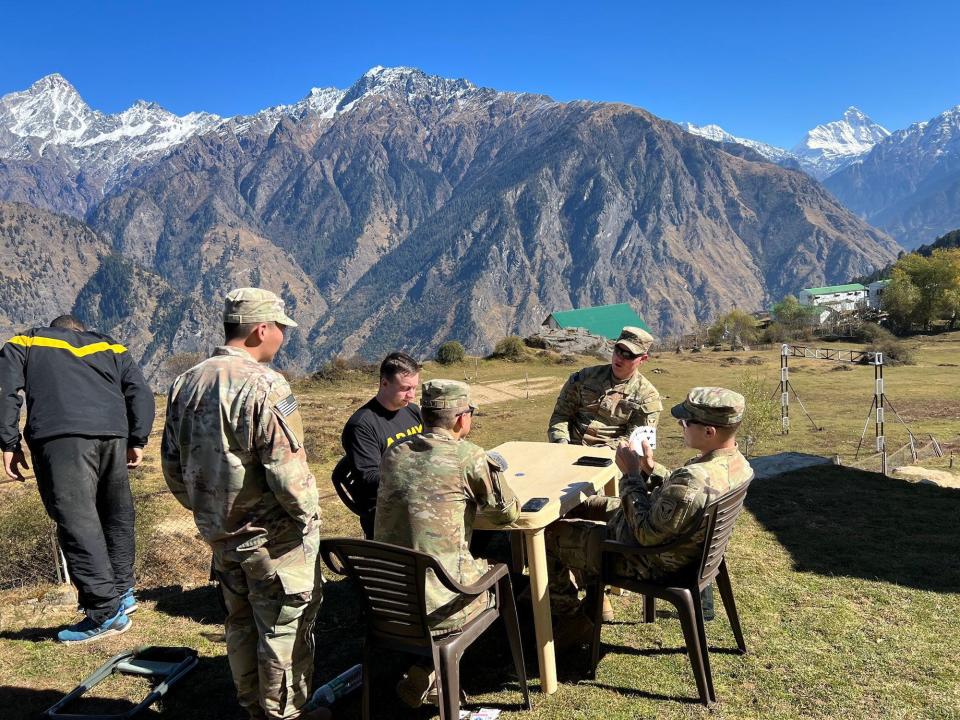 US Army soldiers play cards in Uttarakhand India Himalaya