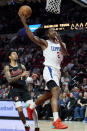 Los Angeles Clippers forward Kawhi Leonard shoots in front of Portland Trail Blazers guard Anfernee Simons during the second half of an NBA basketball game in Portland, Ore., Wednesday, March 20, 2024. (AP Photo/Craig Mitchelldyer)