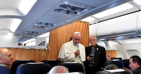 Pope Francis speaks to journalists on his flight back to Rome following a visit at Armenia on June 26, 2016. REUTERS/Tiziana Fabi/Pool