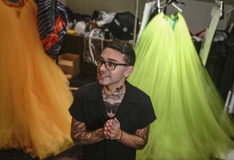 Christian Siriano speaks during a backstage interview before unveiling his latest fashion during New York's Fashion Week, Tuesday, Sept. 7, 2021. (AP Photo/Bebeto Matthews)
