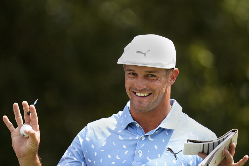 Bryson DeChambeau jokes with the gallery on the third tee during the final round of play in the Tour Championship golf tournament at East Lake Golf Club, Sunday, Sept. 5, 2021, in Atlanta. (AP Photo/Brynn Anderson)