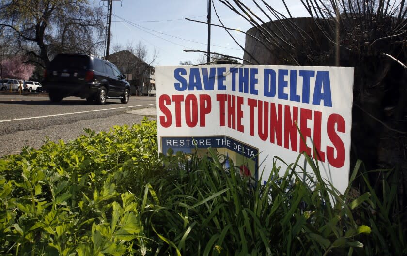 FILE - In this Feb. 23, 2016, file photo, a sign opposing a proposed tunnel plan to ship water through the Sacramento-San Joaquin Delta to Southern California is displayed near Freeport, Calif. The powerful Metropolitan Water District voted Tuesday, Oct. 10, 2017 to pay its share of the $16 billion project to build two massive tunnels to pipe water from Northern California to Southern California cities. The vote gives Gov. Jerry Brown's ambitious project an important boost of support after an influential agricultural group withdrew its support last month. The tunnels, which have been discussed in one form or another for generations, would pipe water around the Sacramento-San Joaquin Delta — where Sierra Nevada water flows toward the sea — to a system of canals that deliver water to farms and residents mostly in the southern half of the state. (AP Photo/Rich Pedroncelli, File)