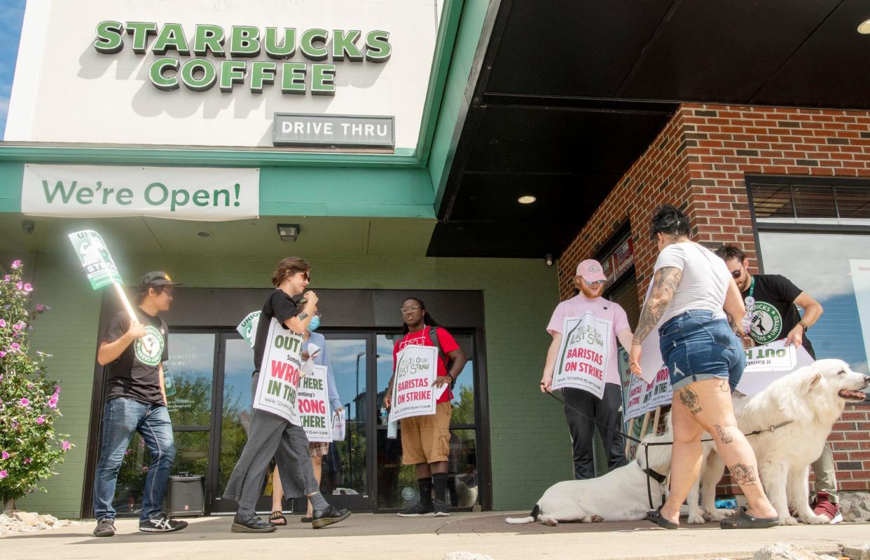 Unionized baristas picket Monday in front of the East Central Street Starbucks in Worcester.