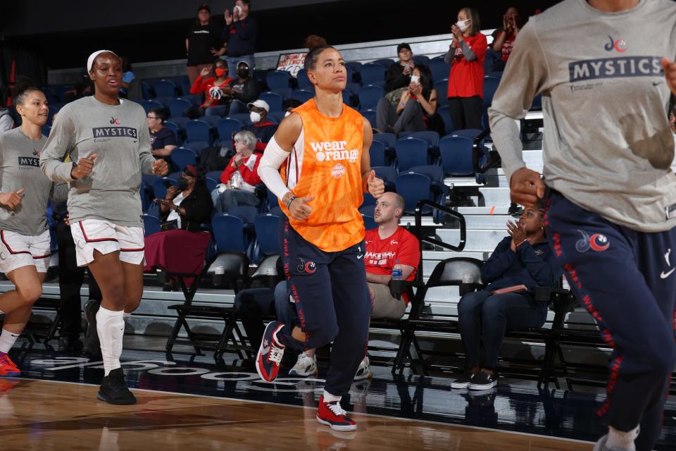 Natasha Cloud sports a "Wear Orange" tank top to honor victims of gun violence.