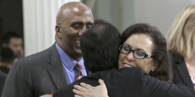 State Sen. Richard Pan, D-Sacramento, left, is hugged by Assemblywoman Lorena Gonzalaz, D-San Diego after his measure requiring nearly all California school children to be vaccinated was approved by the Assembly at the Capitol in Sacramento, Calif., Thursday, June 25, 2015.  Gonzalez carried the bill, SB277 co-authored by Pan and State Sen. Ben Allen D-Santa Monica in the Assembly.  The measure now goes to the governor. (AP Photo/Rich Pedroncelli) (Photo: )