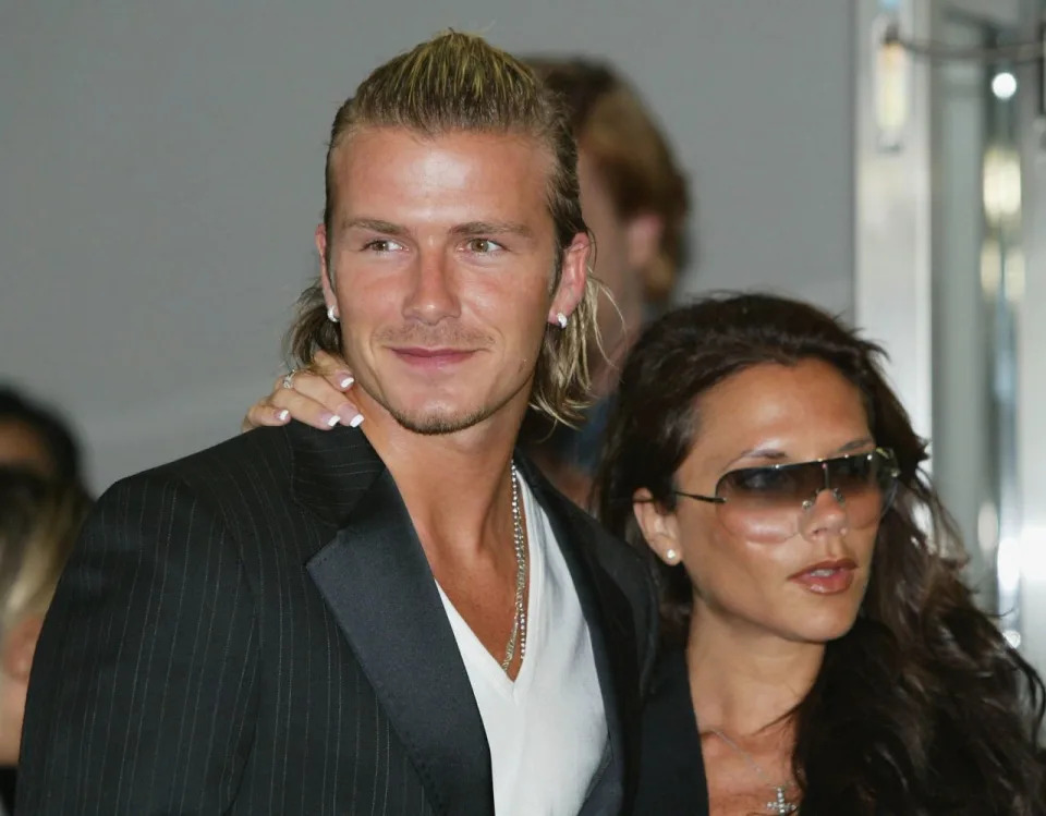 NARITA, JAPAN - JUNE 18: English footballer David Beckham and his wife Victoria arrive at New Tokyo International Airport on June 18, 2003 in Narita, Chiba-Prefecture, Japan. The England mid - fielder Beckham 28, has ended weeks of speculation by agreeing personal terms on a four year contract from Manchester United to Spanish football giants Real Madrid, worth ?24.5m. (Photo by Koichi Kamoshida/Getty Images).