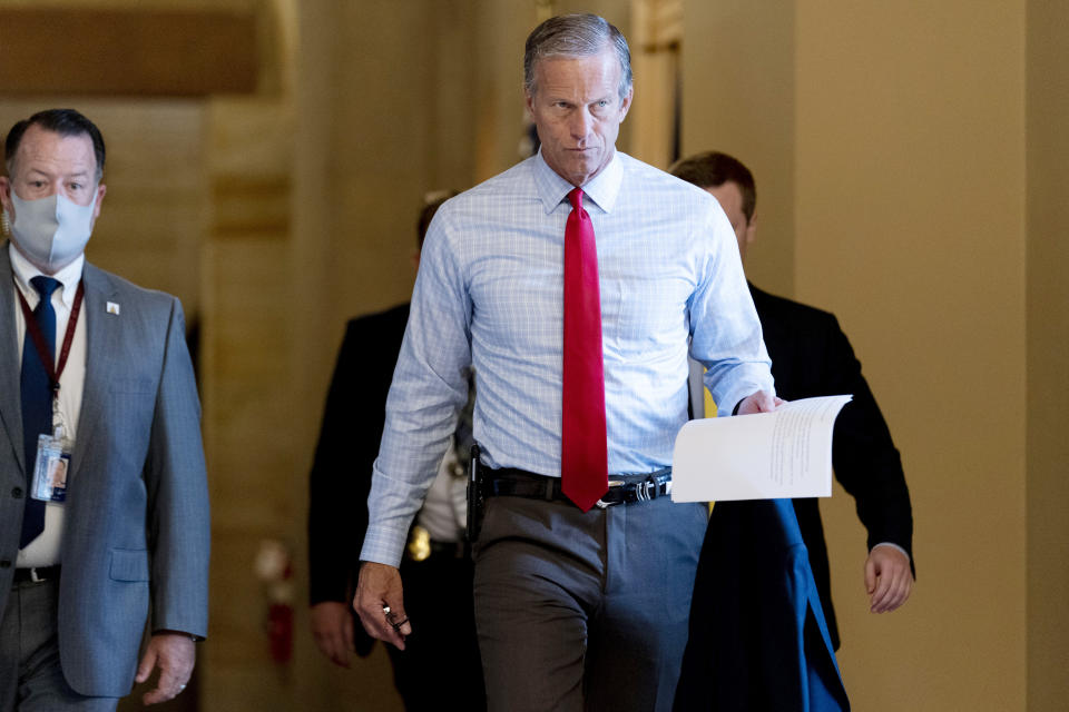 Sen. John Thune, R-S.D., walks out of a meeting in the office of Senate Minority Leader Mitch McConnell of Ky. as a coalition of Democrats and Republicans push the $1 trillion bipartisan infrastructure package closer to passage despite a few holdouts trying to derail one of President Joe Biden's top priorities, at the Capitol in Washington, Monday, Aug. 9, 2021. (AP Photo/Andrew Harnik)