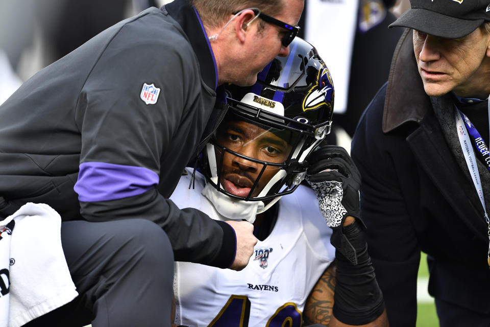 Baltimore Ravens linebacker Chris Board, center, is helped after being injured during the first half of an NFL football game against the Buffalo Bills in Orchard Park, N.Y., Sunday, Dec. 8, 2019. (AP Photo/Adrian Kraus)