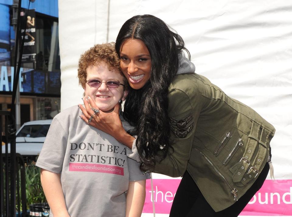 Keenan Cahill poses with pop star Ciara in 2011 (Getty Images)