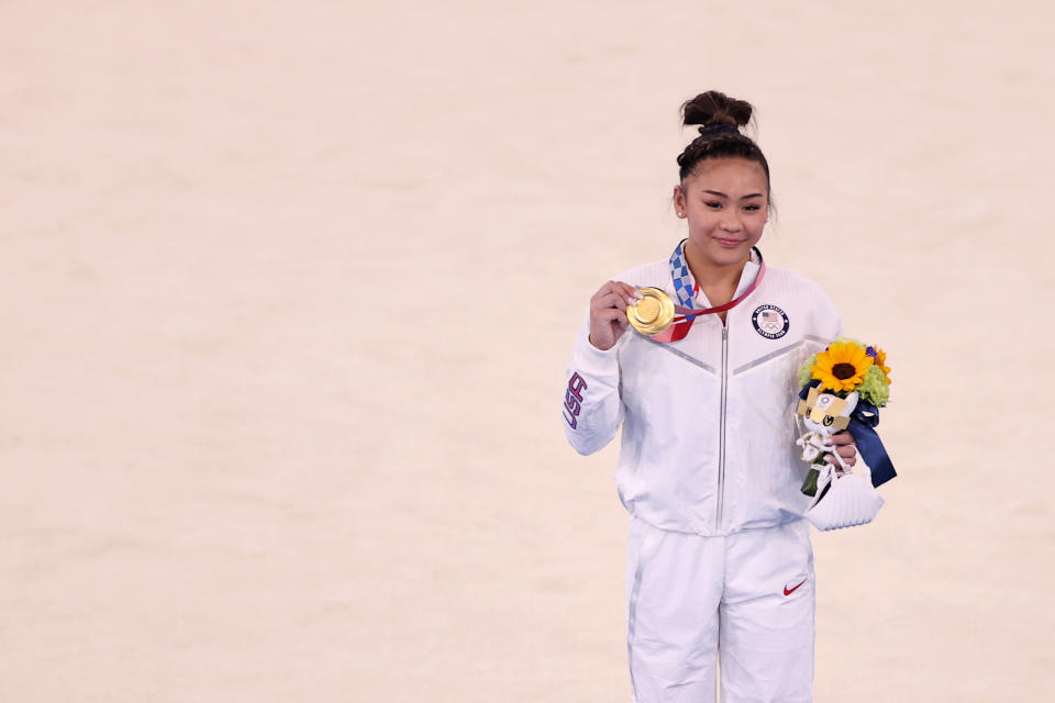 TOKYO, JAPAN - JULY 29: Sunisa Lee of Team United States poses with her gold medal after winning the Women's All-Around Final on day six of the Tokyo 2020 Olympic Games at Ariake Gymnastics Centre on July 29, 2021 in Tokyo, Japan. (Photo by Laurence Griffiths/Getty Images)