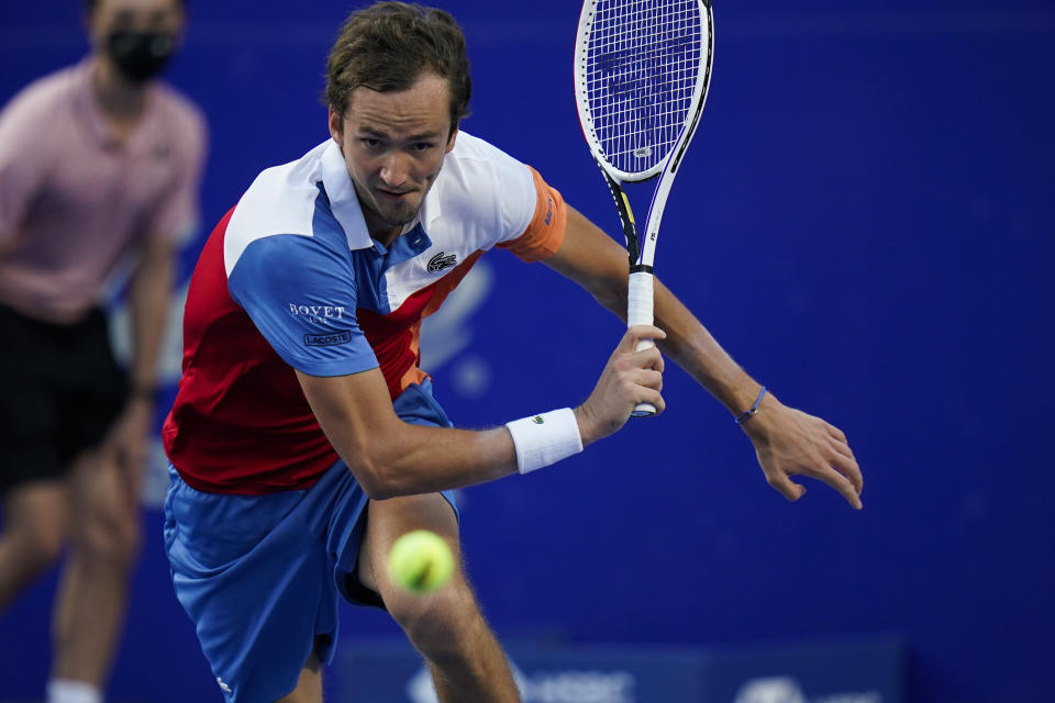 Daniil Medvedev of Russia returns a ball during a match against to Benoit Paire of France at the Mexican Open tennis tournament in Acapulco, Mexico, Tuesday, Feb. 22, 2022. (AP Photo/Eduardo Verdugo)