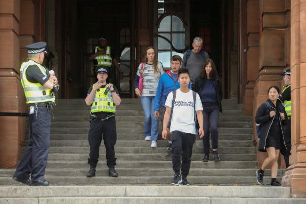 Climate protestors glue themselves to 'painting' in Glasgow gallery