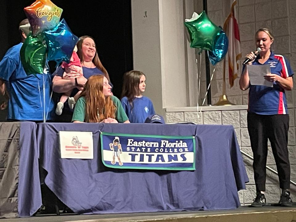 Ali Tuggle (seated), joined by family, was one of several Cocoa Beach seniors signing with college sports programs on May 8, 2024.