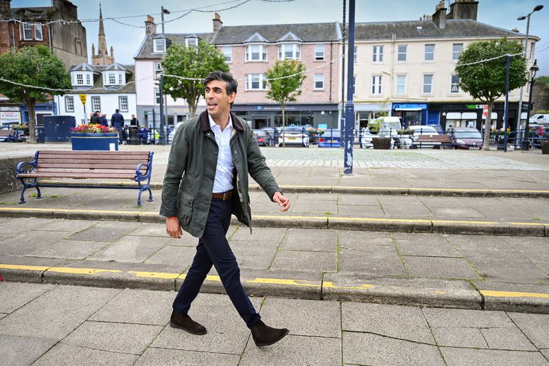 FILE PHOTO: Britain's Chancellor of the Exchequer Rishi Sunak meets with local business people during a visit to Rothesay