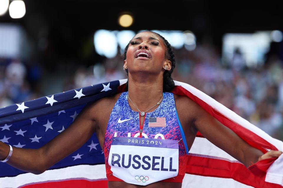 7 photos of Masai Russell's photo finish to win Olympic women's 100m