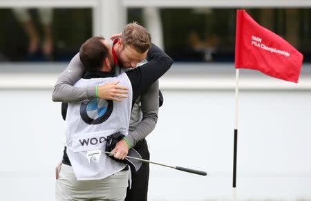 Britain Golf - BMW PGA Championship - Wentworth Club, Virginia Water, Surrey, England - 29/5/16. England's Chris Wood and his caddie celebrates winning the BMW PGA Championship on the 18th green. Action Images / Paul Childs Livepic