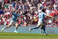 Manchester City's Ilkay Gundogan celebrates after scoring his side's first goal during the English FA Cup final soccer match between Manchester City and Manchester United at Wembley Stadium in London, Saturday, June 3, 2023.(AP Photo/Jon Super)