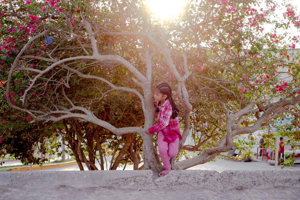 A girl plays in the migrant camp in Matamoros, Mexico, on April 23. The city has the highest case count and death toll in the state. | Fred Ramos