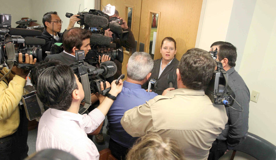 CORRECTS TO JUDGE HAMILTON, NOT COLLINS IN SECOND SENTENCE - Colleen and Boby Middleton, the parents of victim Robert Middleton, speak to the media after hearing regarding Don Willburn Collins at the 359th Judicial District Court with Judge Kathleen Hamilton on Thursday, March 6, 2014, in Conroe, Texas. Collins, now 28, accused of dousing Middleton with gasoline and setting him on fire in 1998 when he was a teenager, can be tried as an adult for murder after the victim died from his burns nearly 13 years later, Judge Hamilton ruled Thursday. (AP Photo/ The Courier, Jason Fochtman) MANDATORY CREDIT