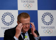 International Olympic Committee (IOC) Vice President and Chairman of the Coordination Commission for the Tokyo 2020 Games John Coates adjusts his glasses at a news conference in Tokyo, Japan, December 2, 2016. REUTERS/Kim Kyung-Hoon