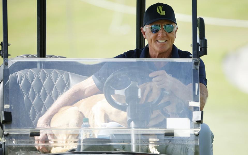 Norman and his dog out on the fairway at the Trump Doral in Miami on Thursday