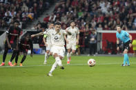 Roma's Leandro Paredes scores on a penalty kick during the Europa League second leg semi-final soccer match between Leverkusen and Roma at the BayArena in Leverkusen, Germany, Thursday, May 9, 2024. (AP Photo/Matthias Schrader)
