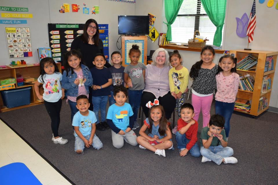 The last class at Inter-Faith Community Preschool in Fort Smith, posing with director Ann Law, sitting in center, will graduate May 17 as the school closes after 56 years.
