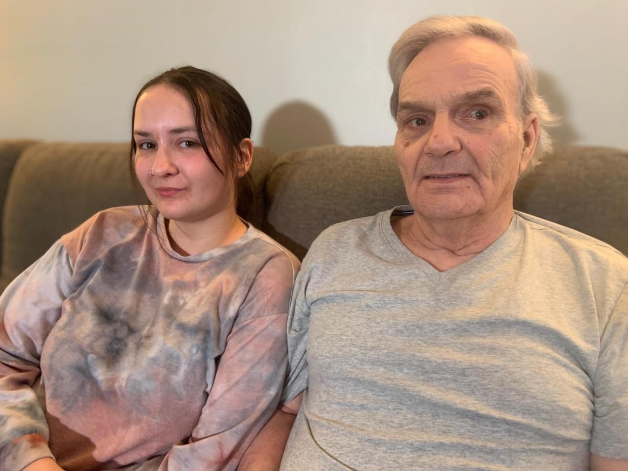 Emily Colbourne, left, and Ron Oliver. Oliver is worried about losing home care after he was forced to pay out of pocket for months because of delayed insurance claims. He says he is able to stay in his own home with the help of home care worker Emily Colbourne.  (Darrell Roberts/CBC - image credit)