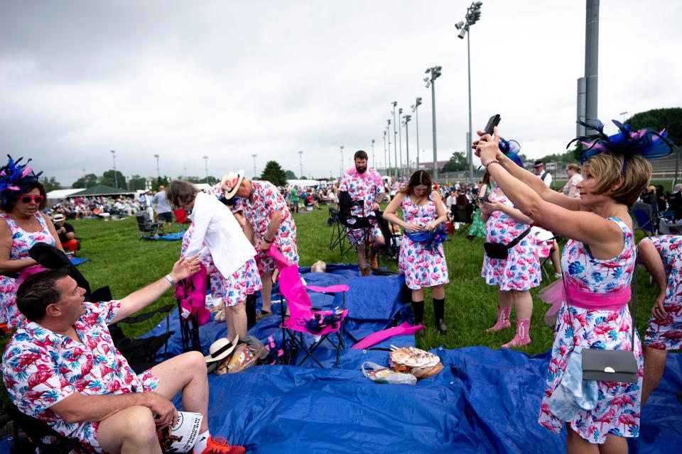 A group of people all dressed in the same pattern set up in the infield for the 150th Kentucky Derby in Louisville, Ky., on Saturday, May 4, 2024.